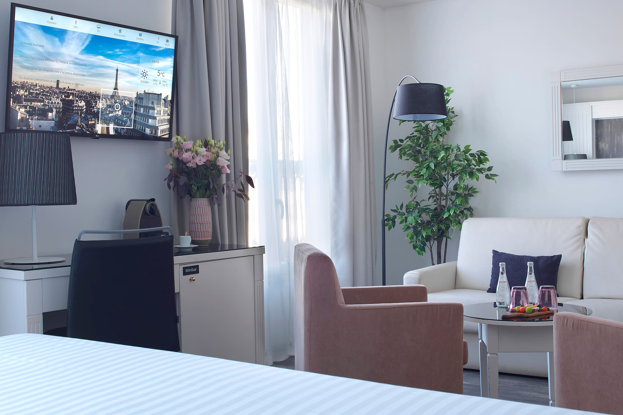 a room with a television and a tv on the wall