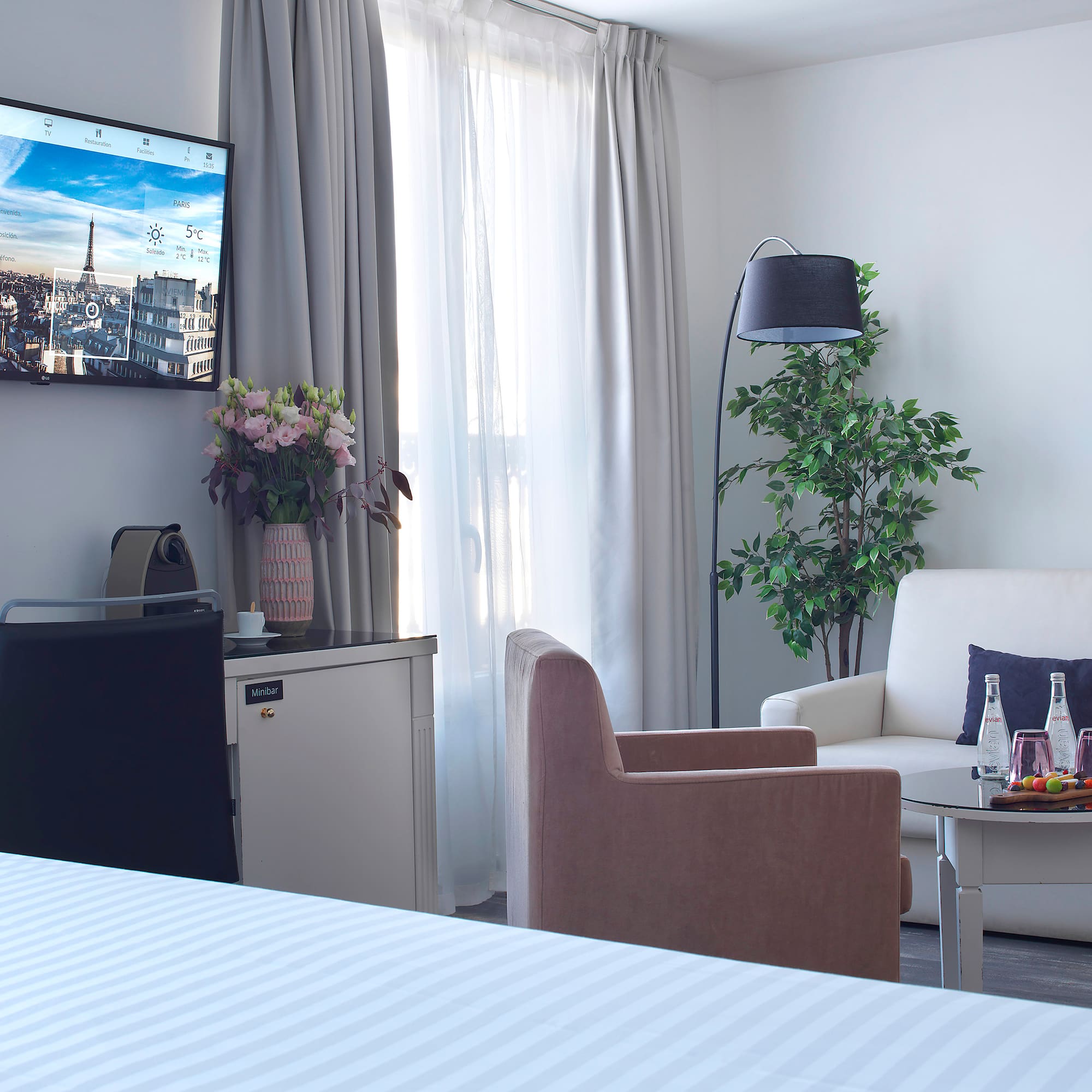 a room with a television and a tv on the wall