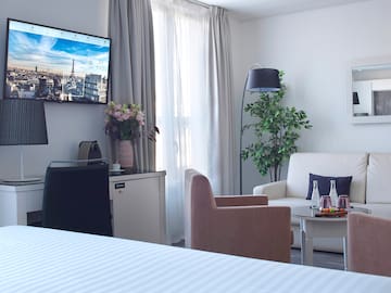 a room with a television and a tv on the wall