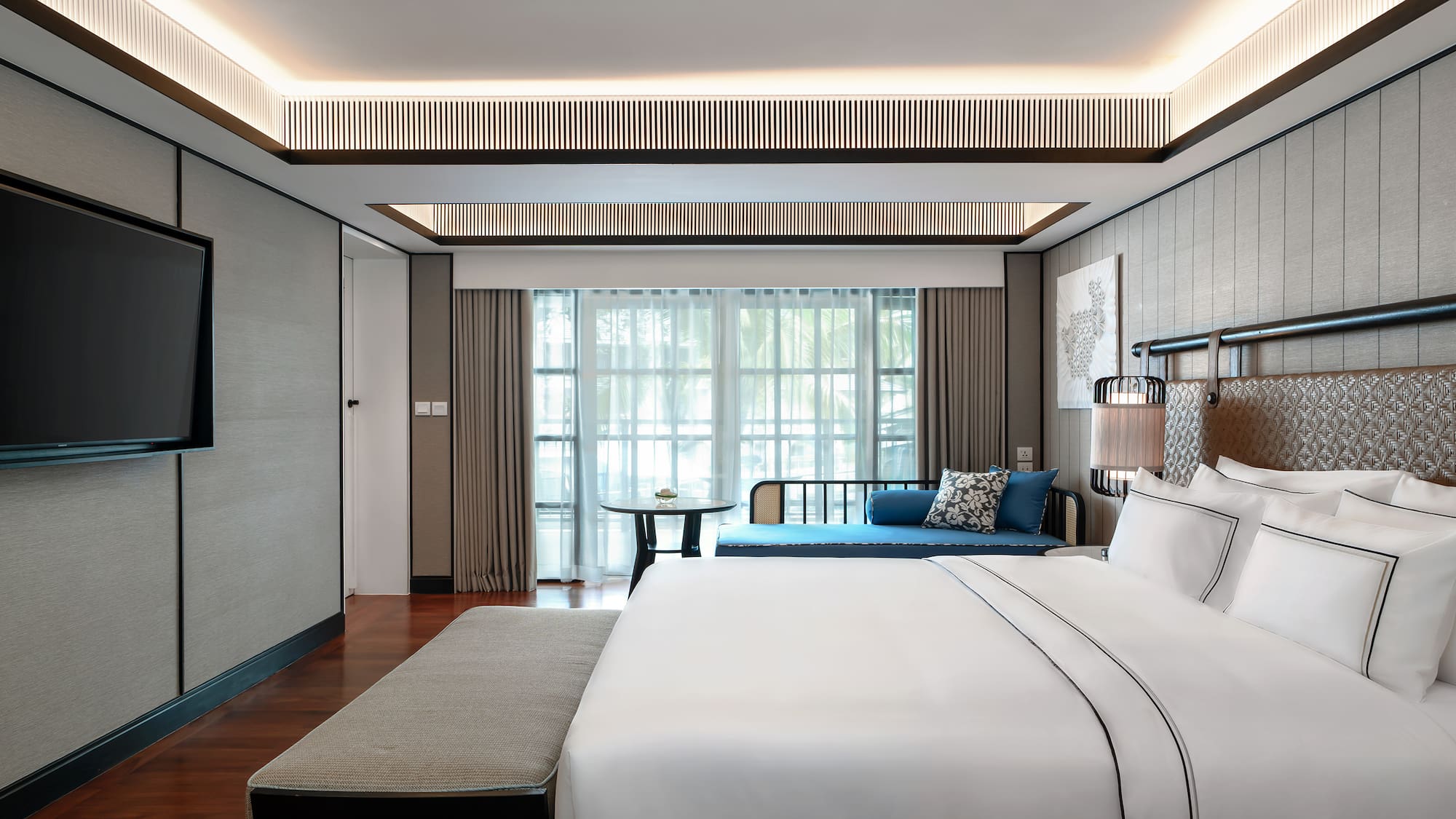 a bedroom with a bed and a table