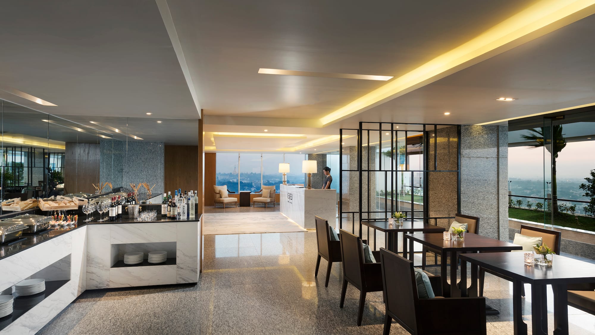 a room with a bar and chairs