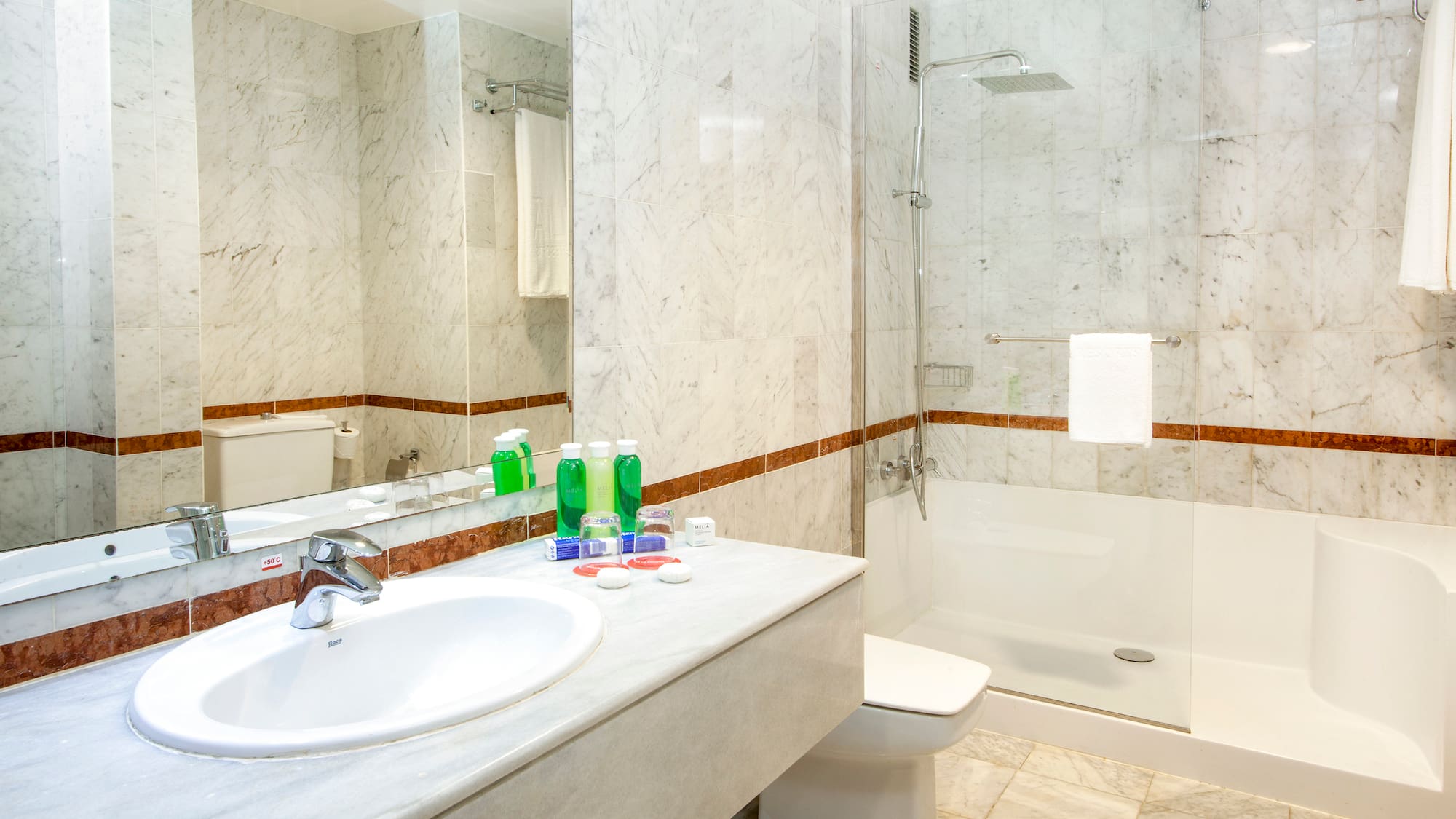 a bathroom with a sink and shower