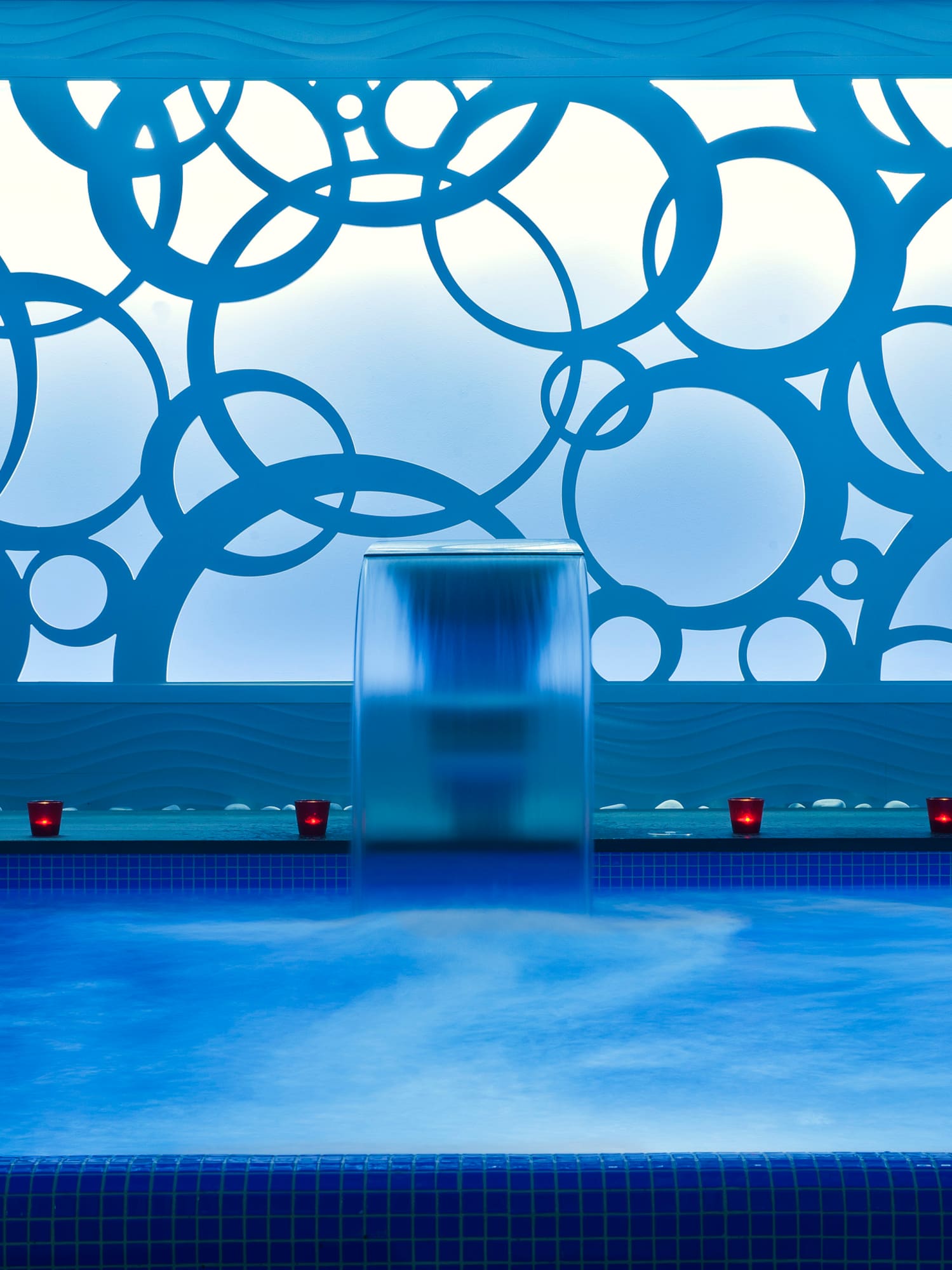 a water fall in a pool