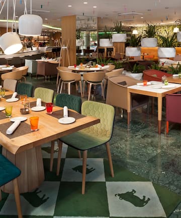 a restaurant with tables and chairs.