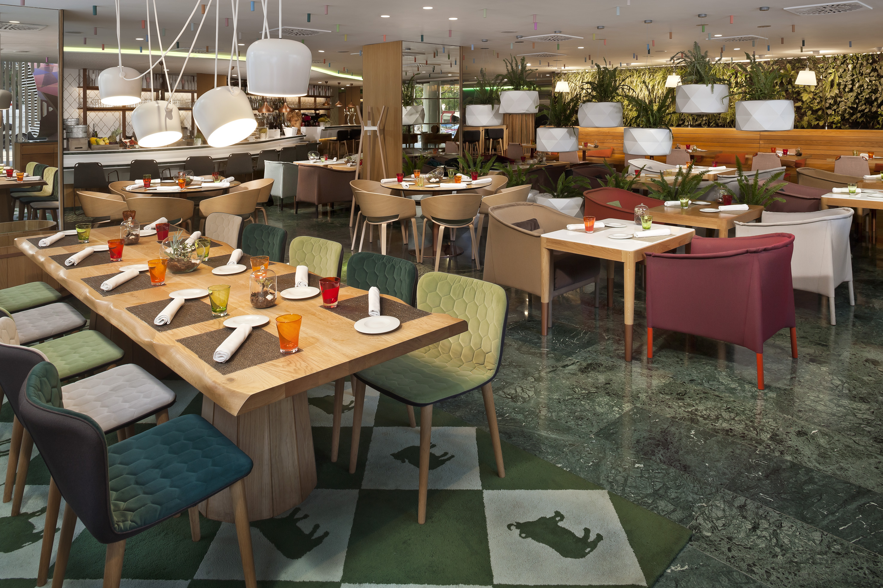 a restaurant with tables and chairs.