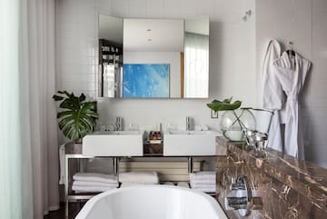 a bathroom with a large mirror and sink