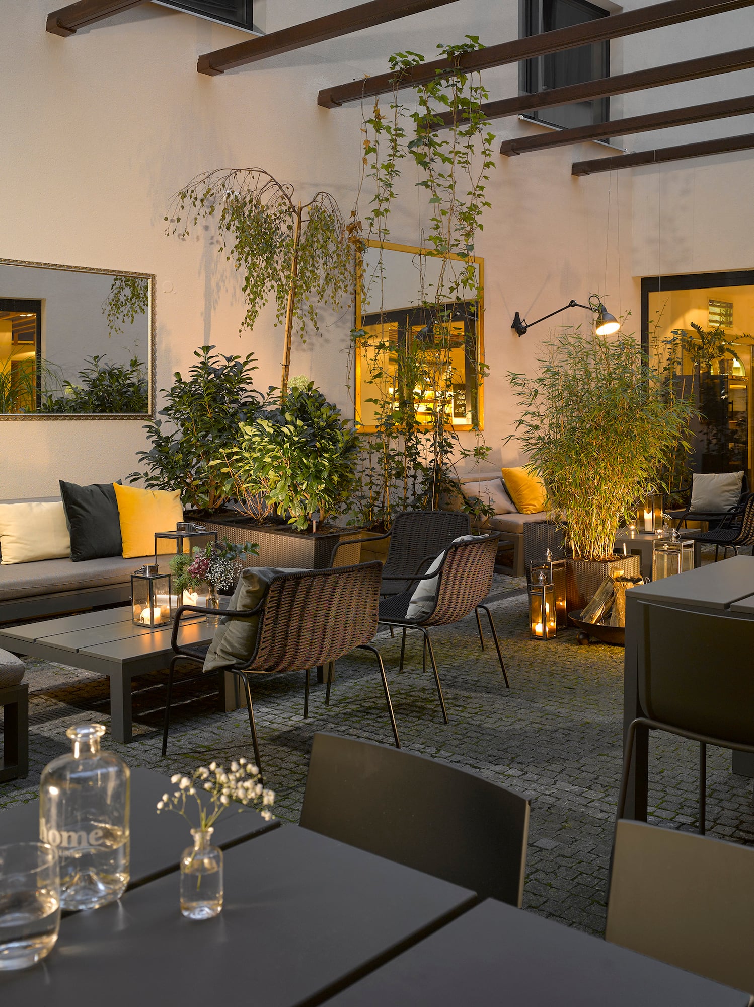 a patio area with tables and chairs