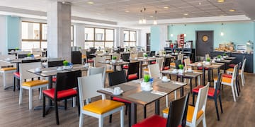 a room with tables and chairs