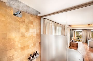 a bathroom with a mirror and a bathtub