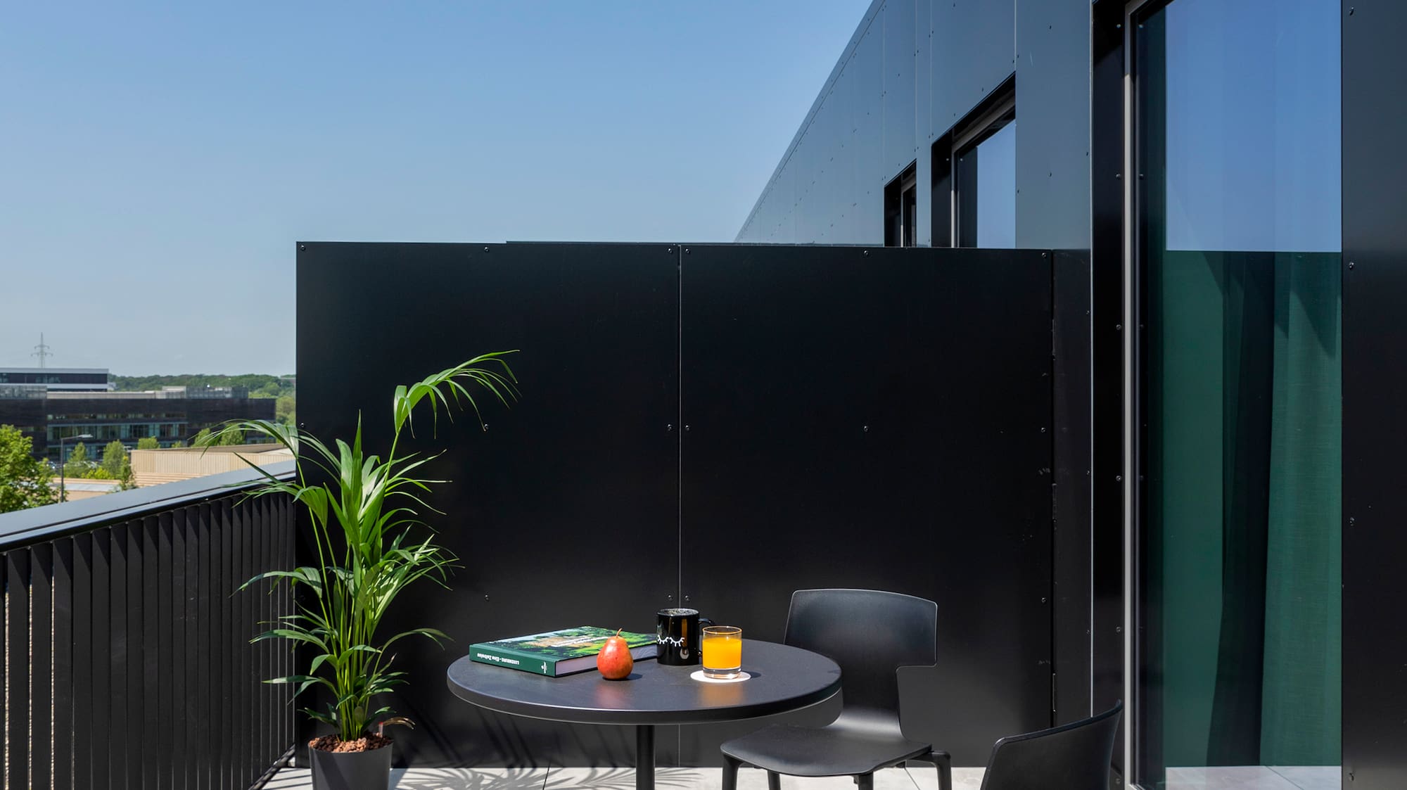 a table and chairs on a balcony