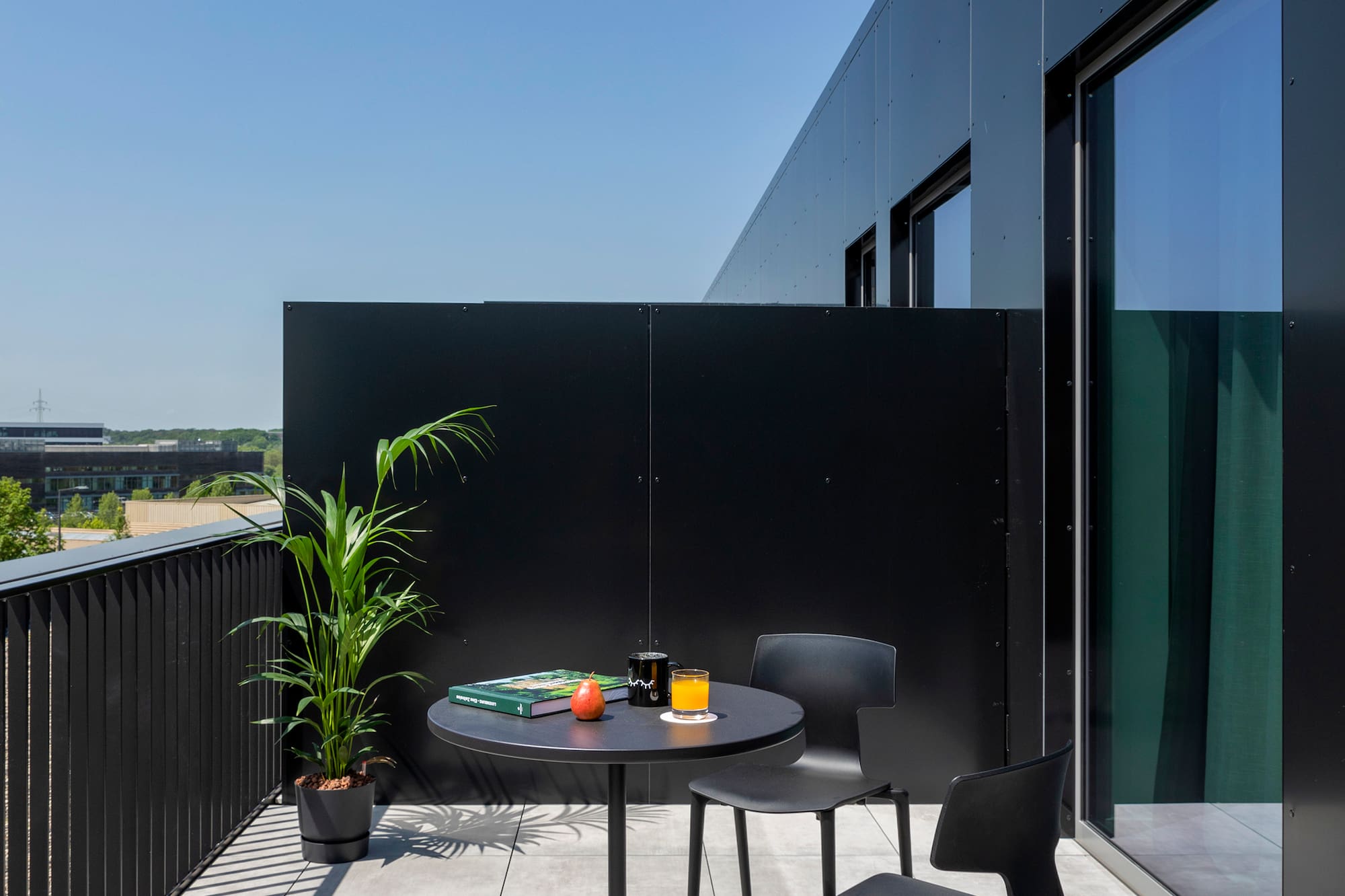 a table and chairs on a balcony