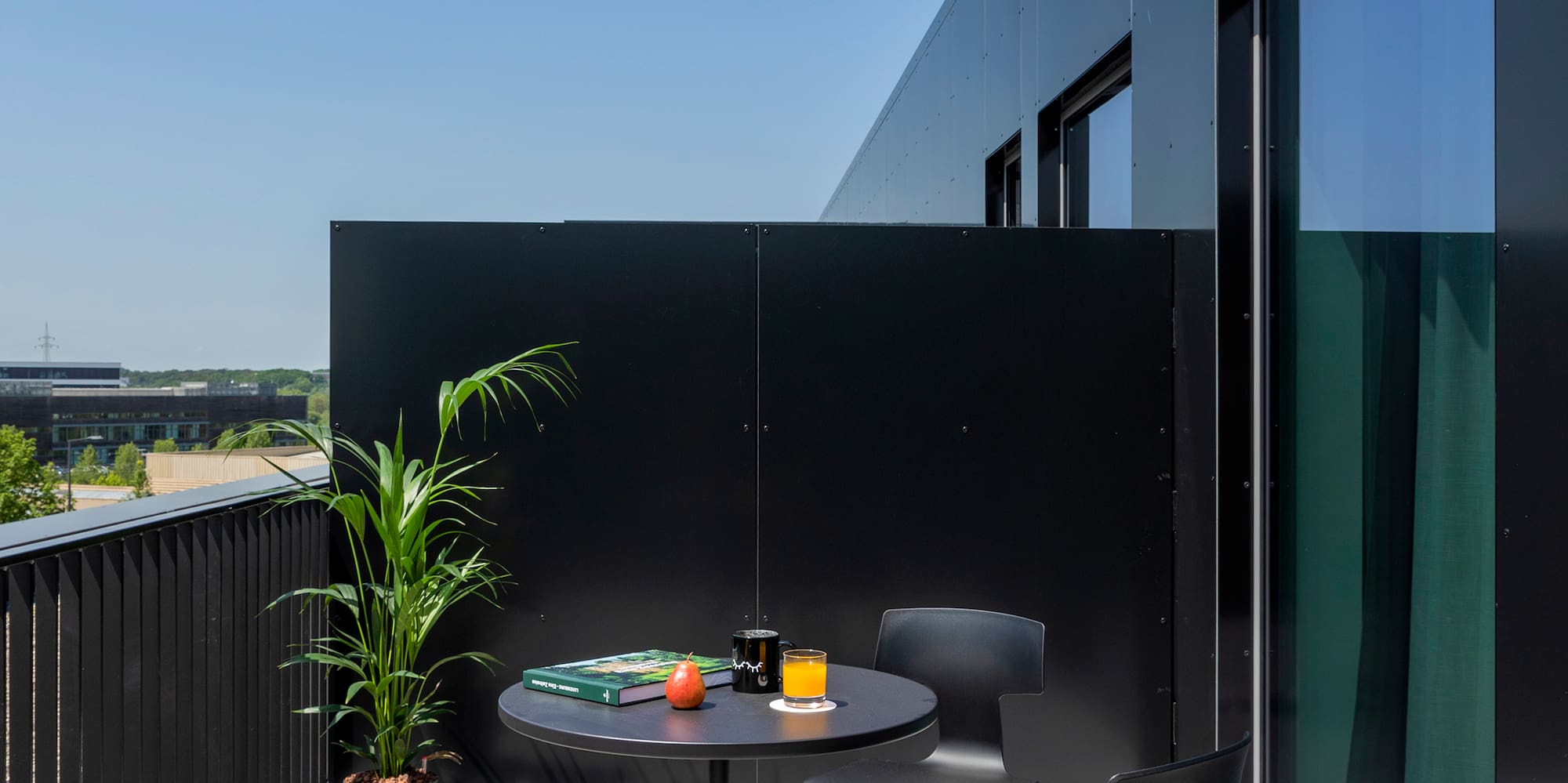 a table and chairs on a balcony