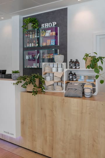 a counter with shelves and plants on it