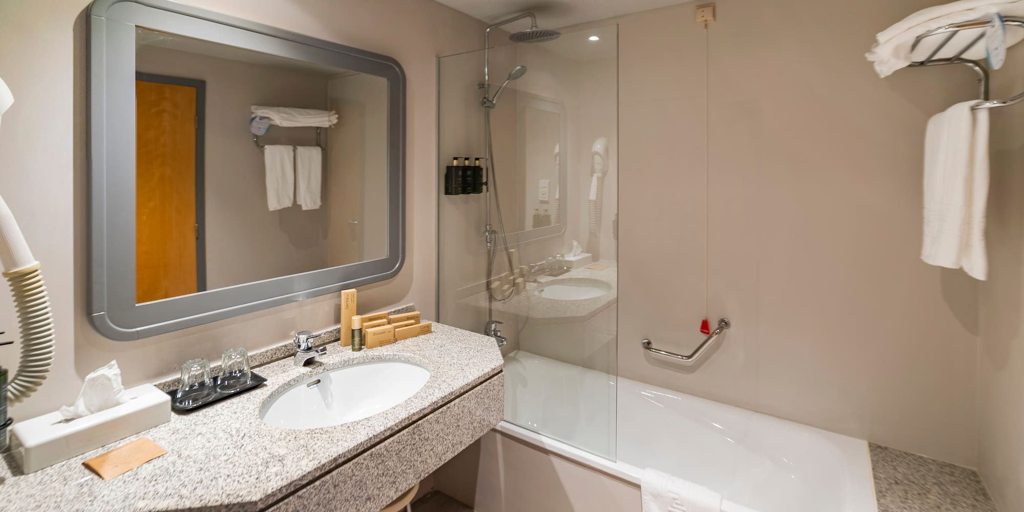 a bathroom with a bathtub and sink