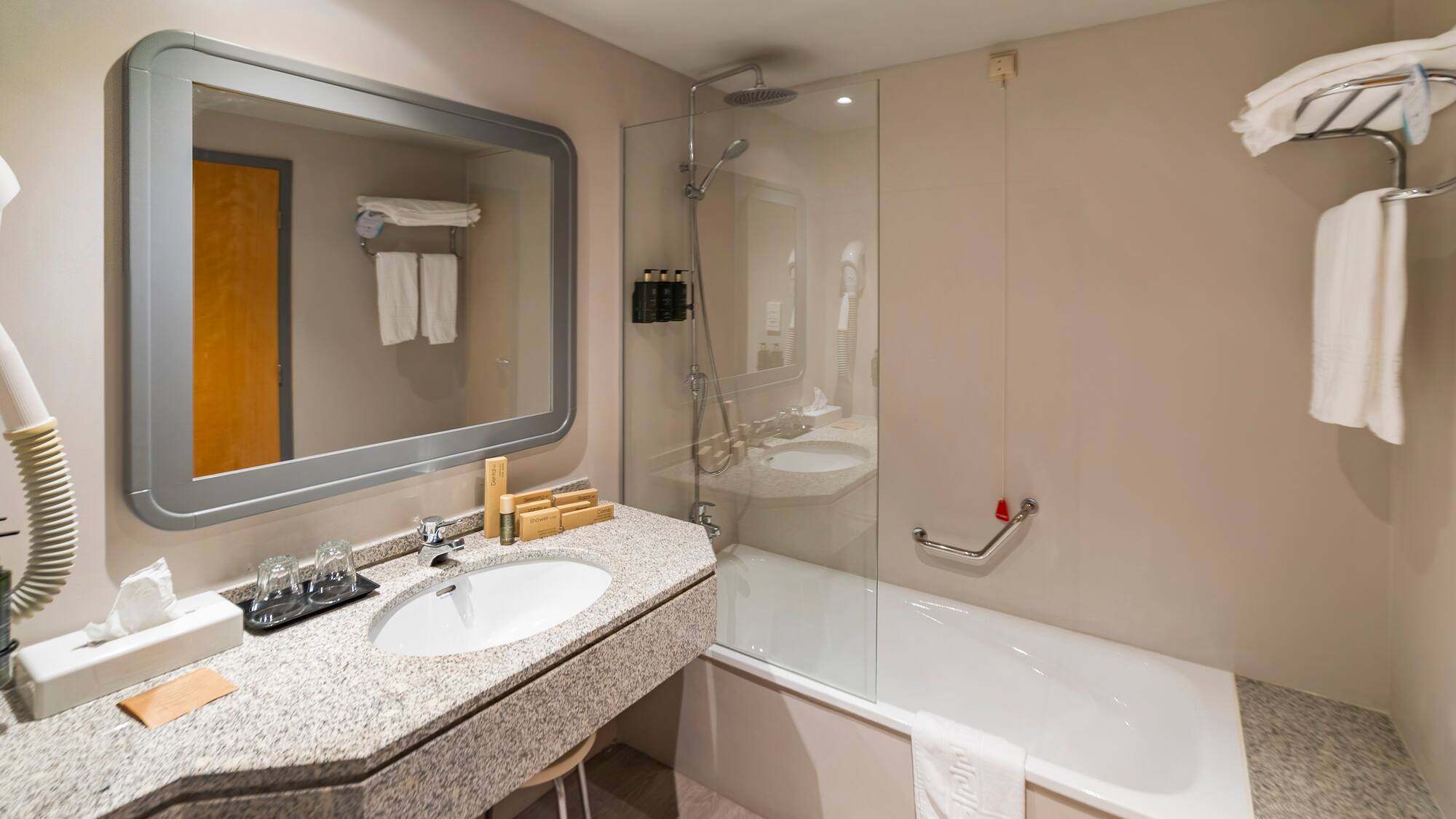 a bathroom with a bathtub and sink