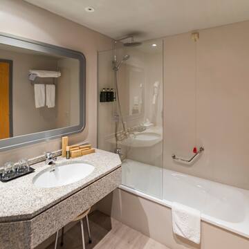 a bathroom with a bathtub and sink