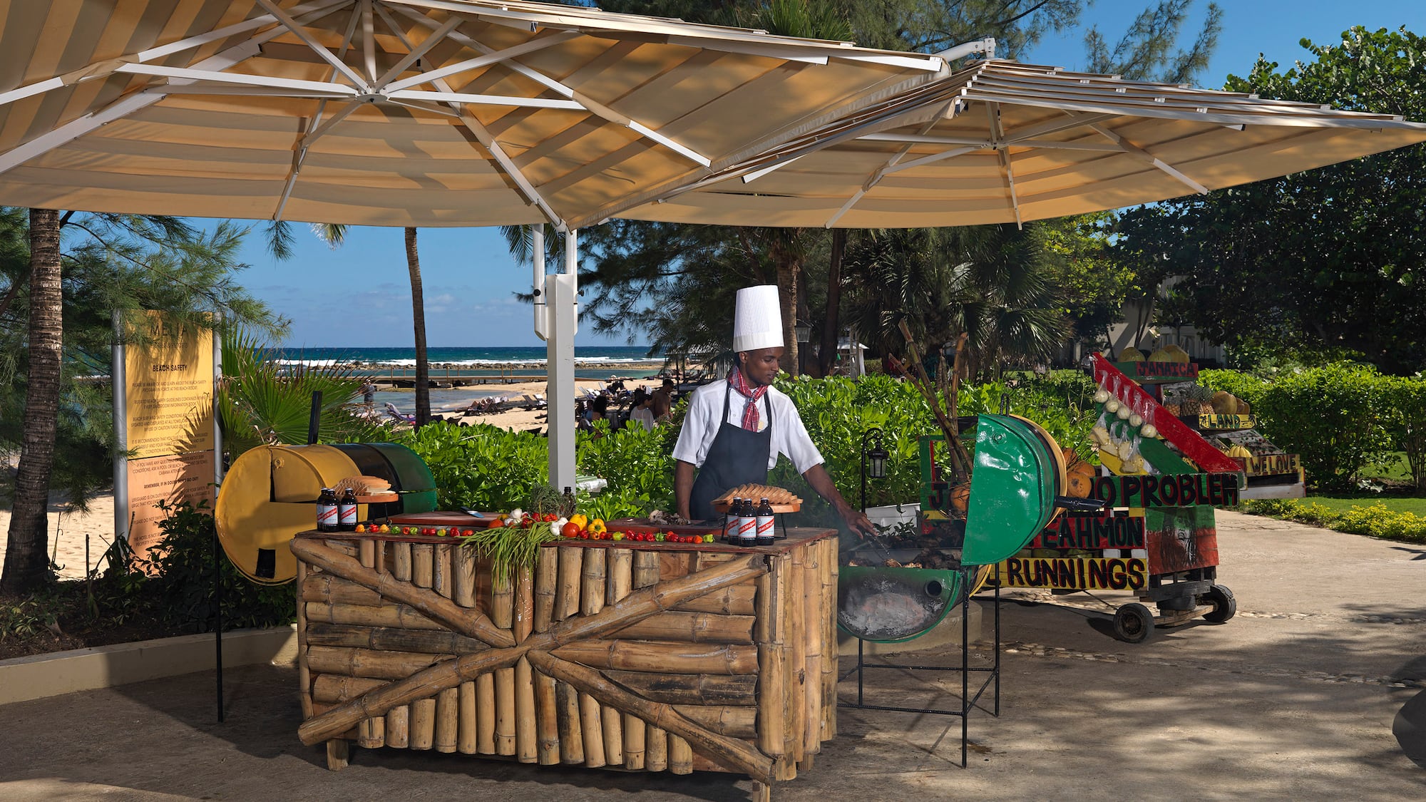 a man cooking food under a canopy