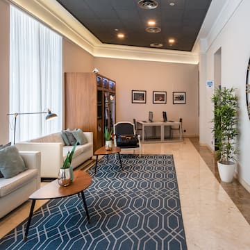 a room with a large clock and a couch