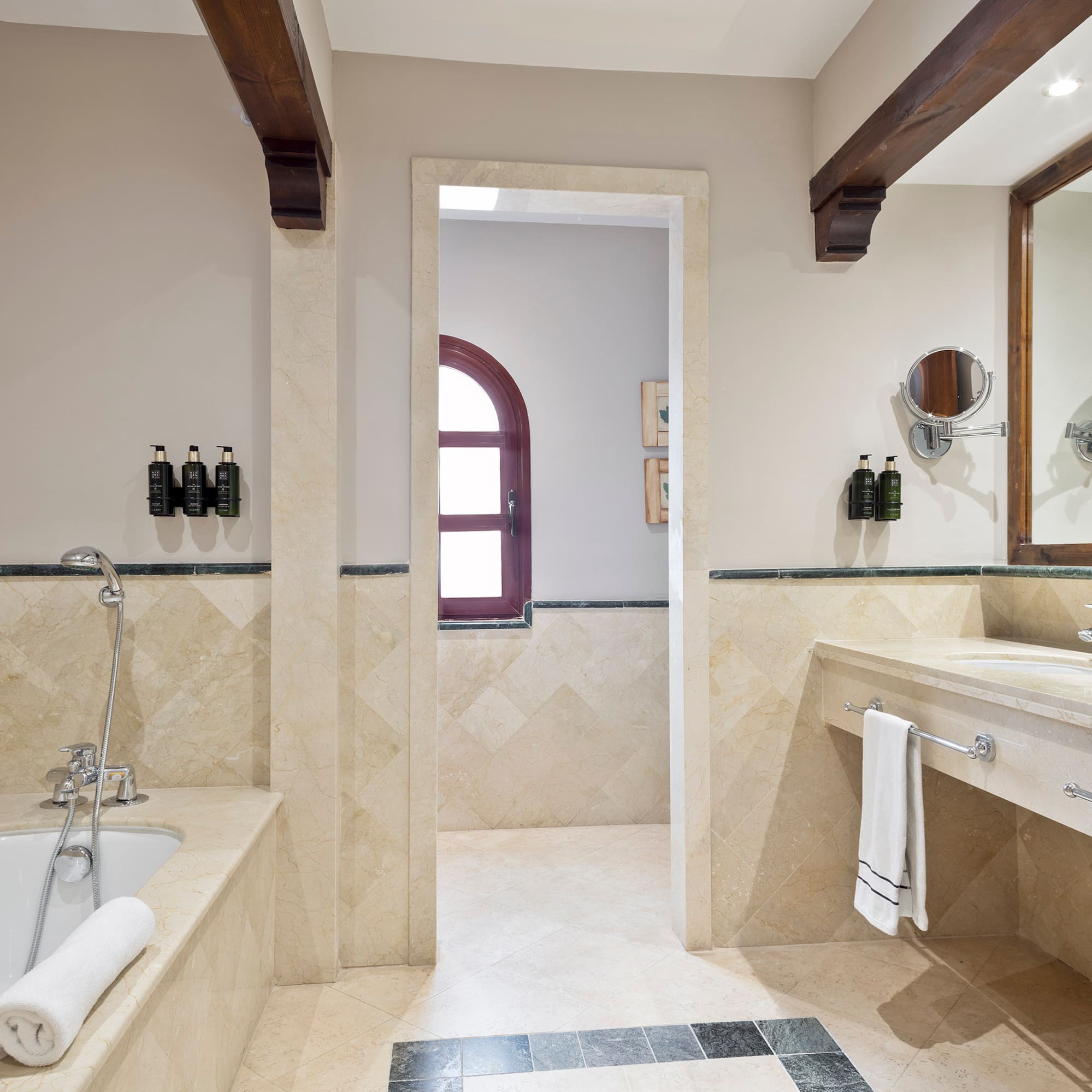 a bathroom with a tub and sink