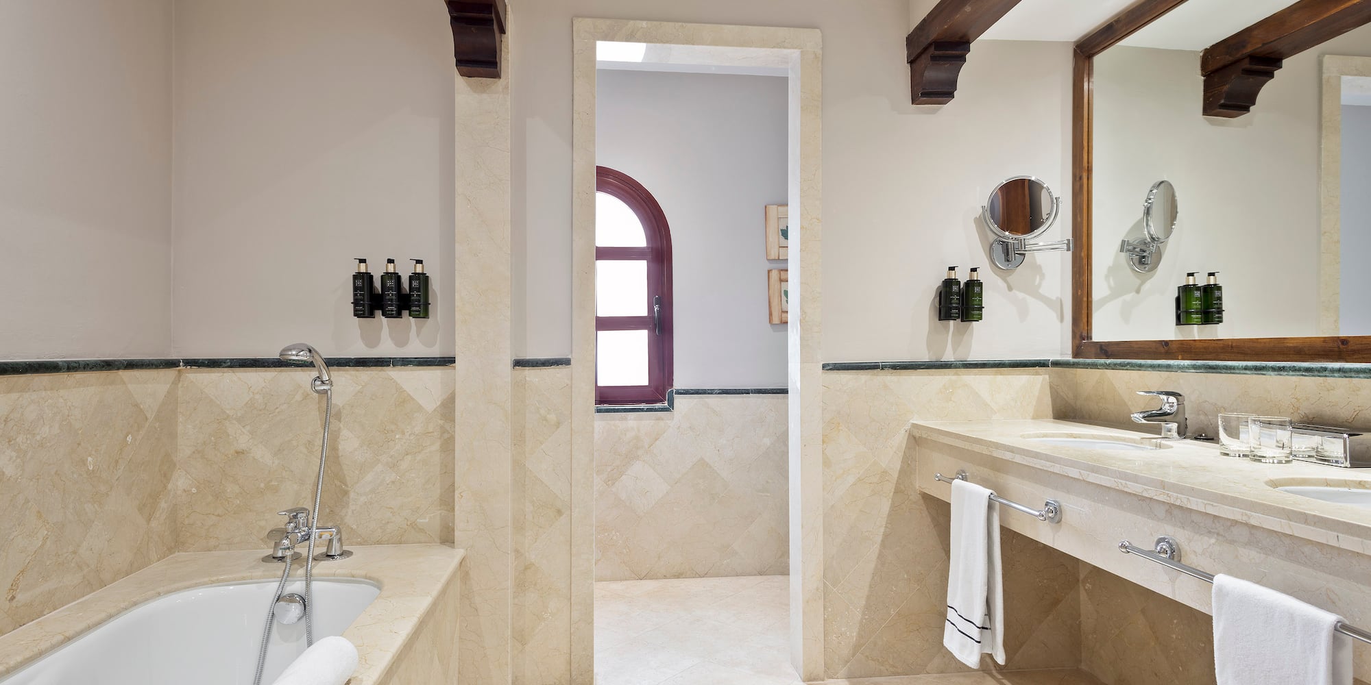 a bathroom with a tub and sink