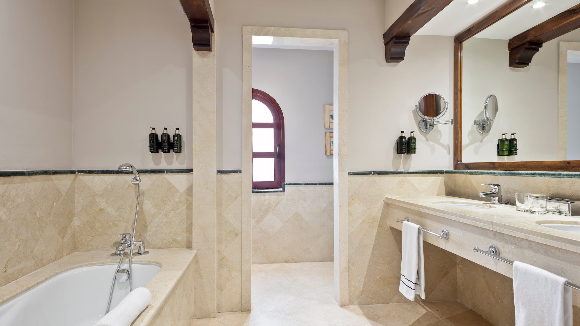 a bathroom with a tub and sink