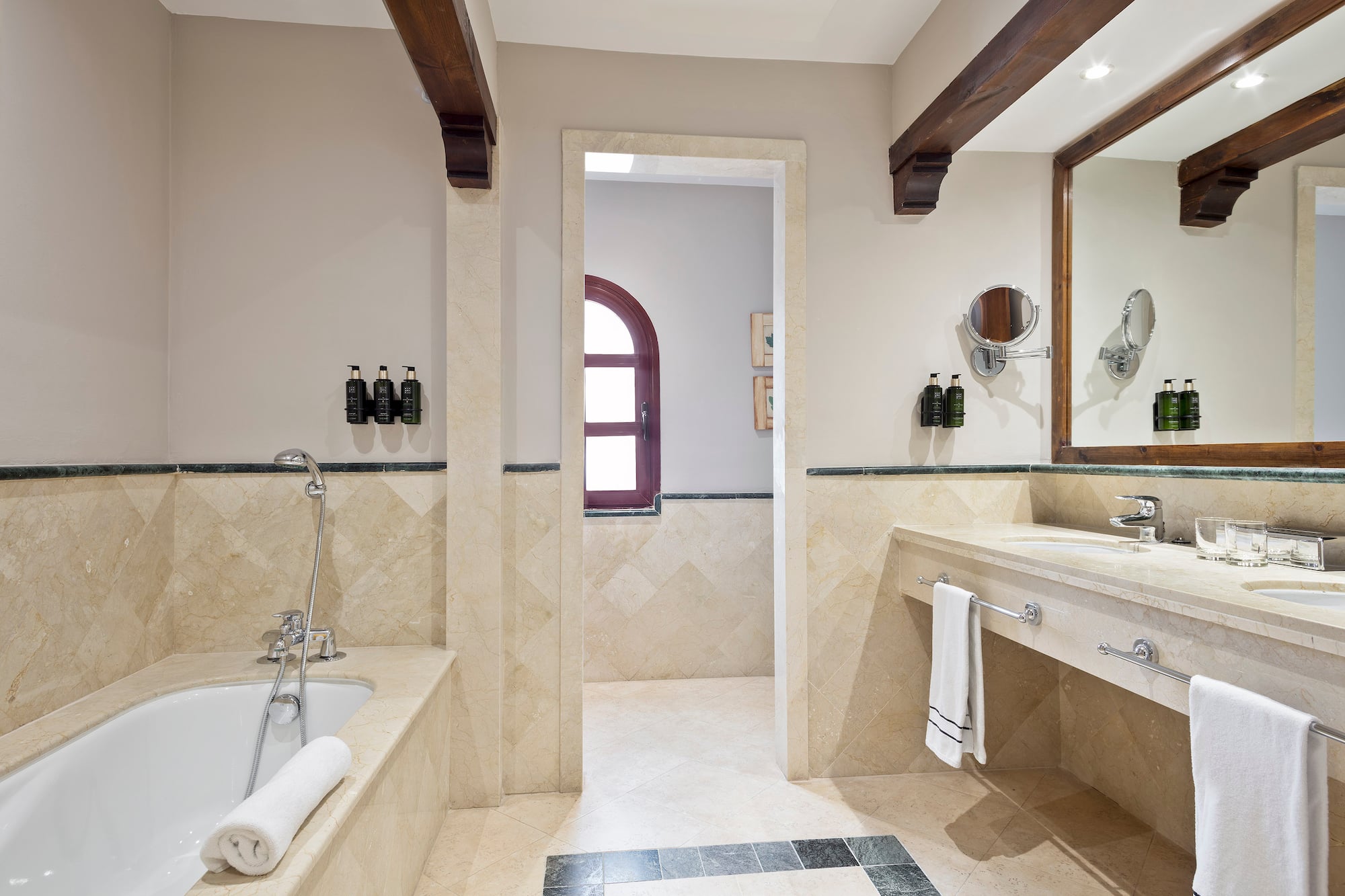 a bathroom with a tub and sink