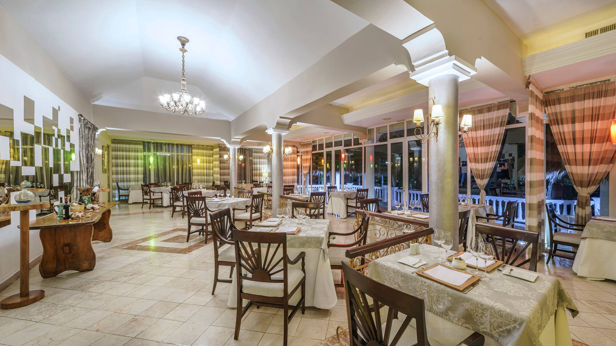 a restaurant with tables and chairs