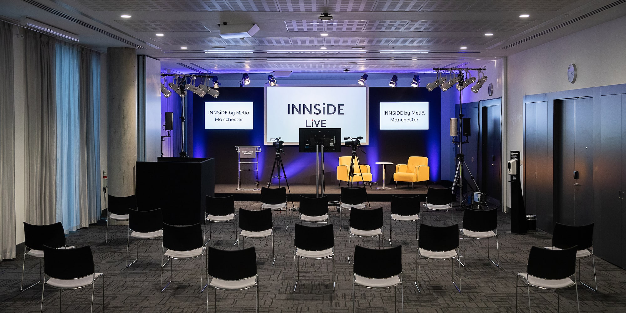 a room with chairs and a stage