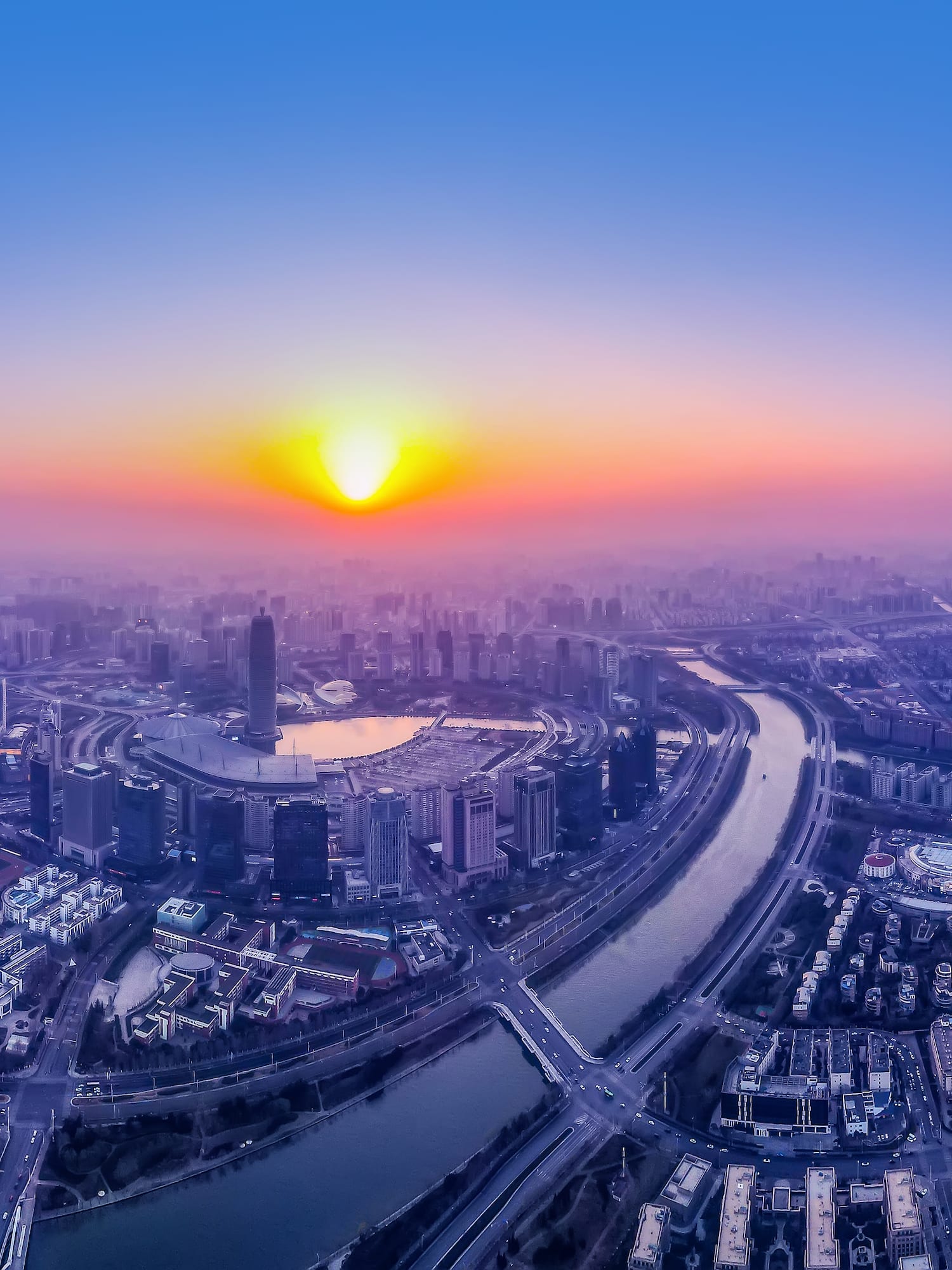 a city with a river and a city in the background