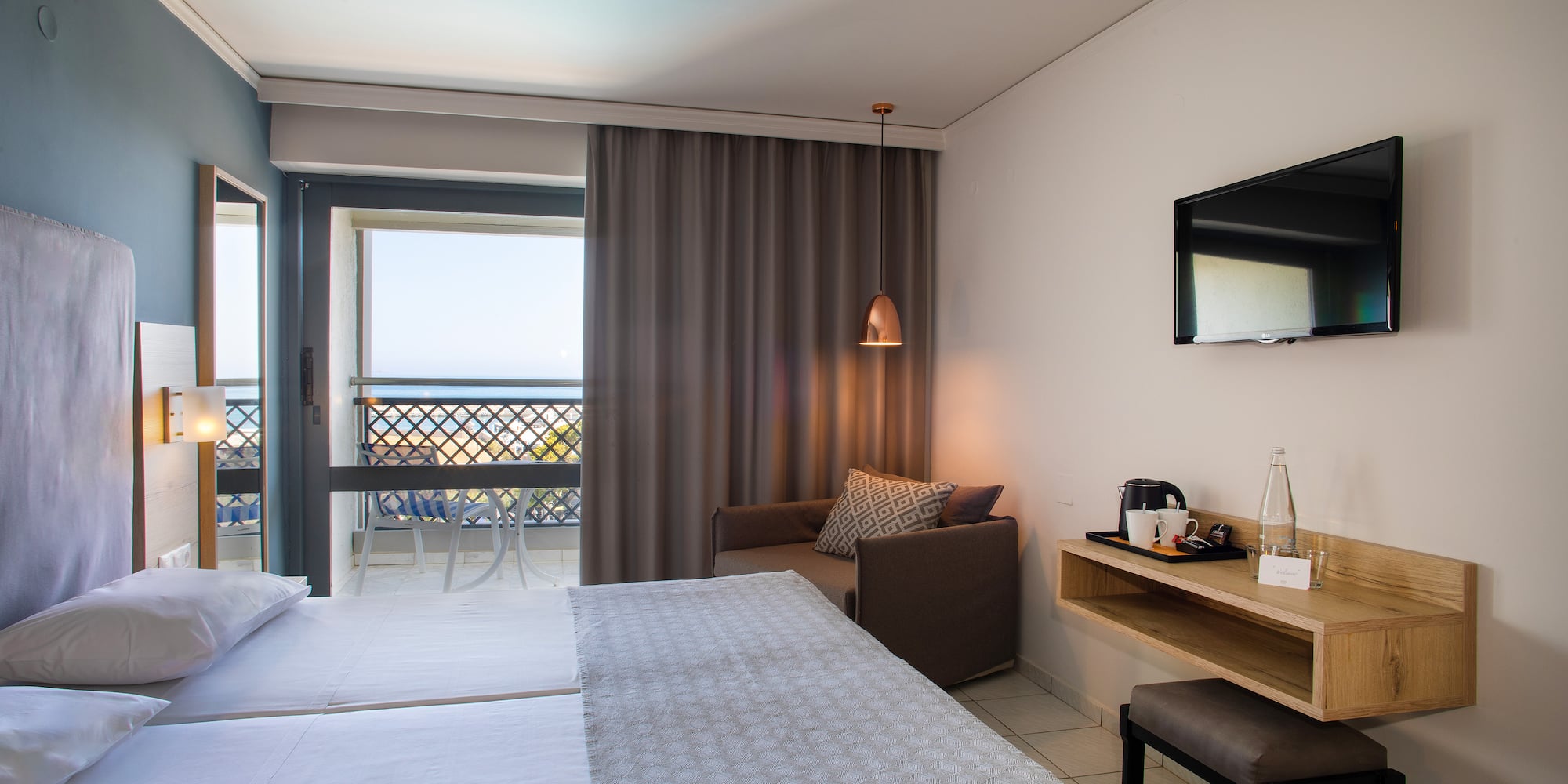 a room with a bed and a television