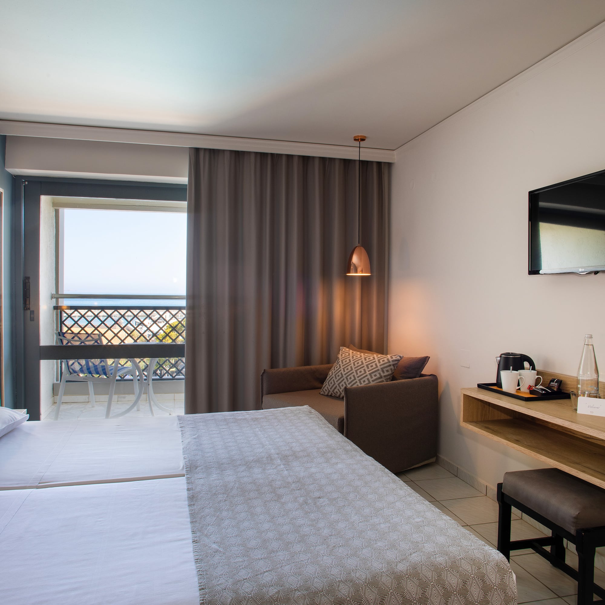 a room with a bed and a television