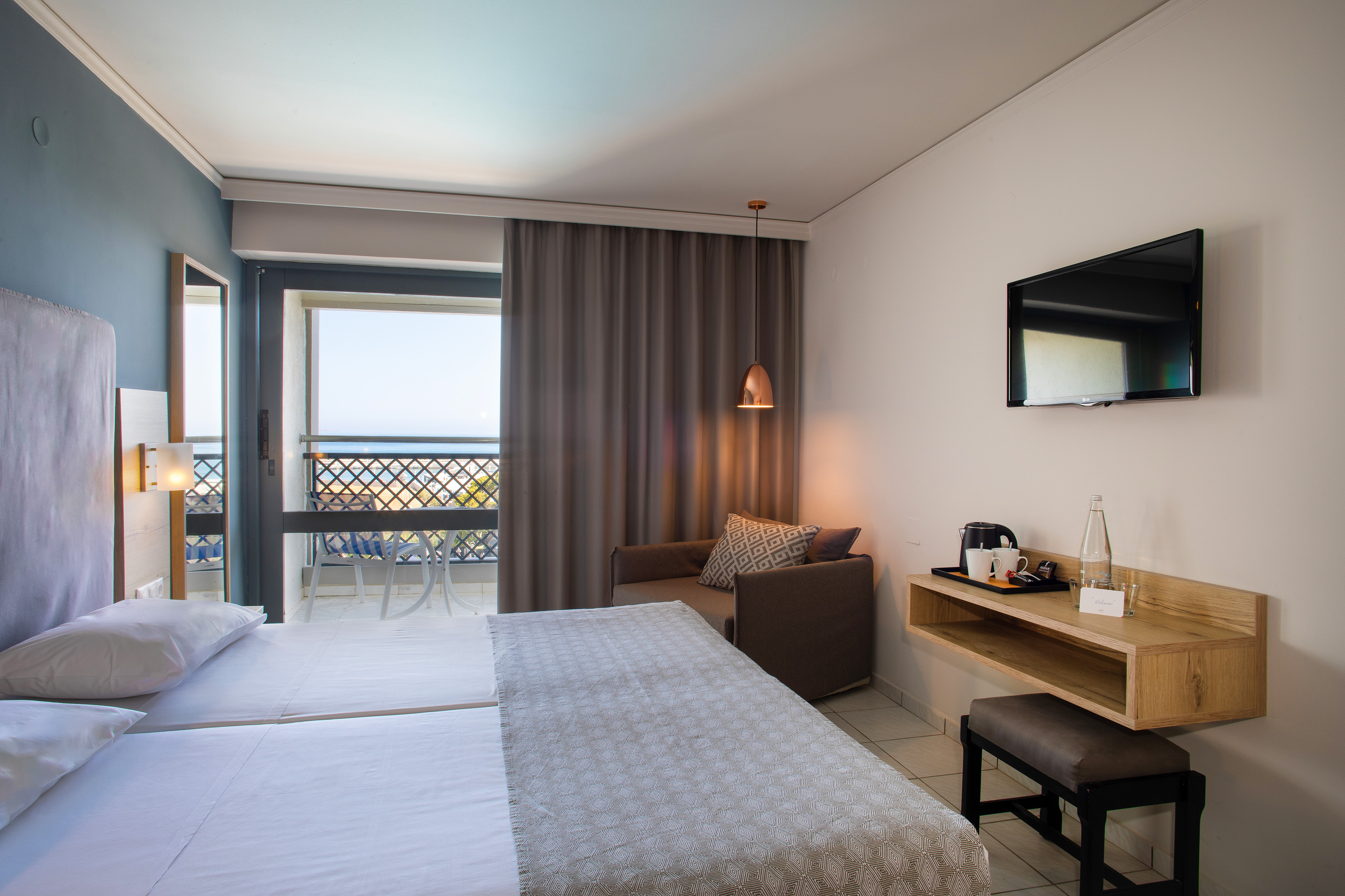 a room with a bed and a television