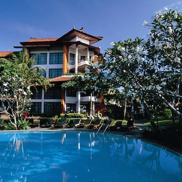 a swimming pool in front of a building
