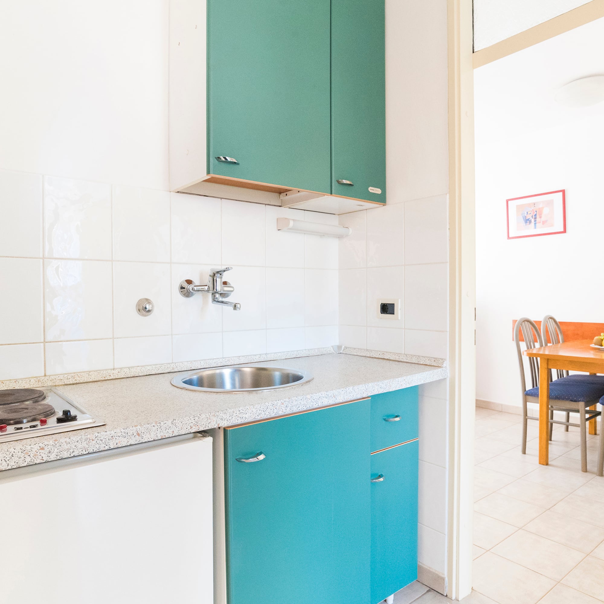 a kitchen with a sink and cabinets