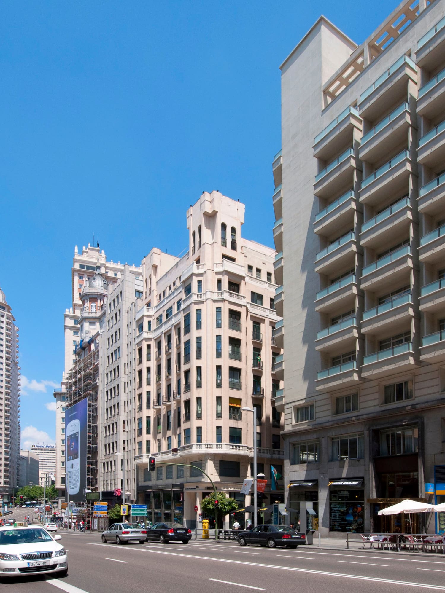 a street with cars and buildings