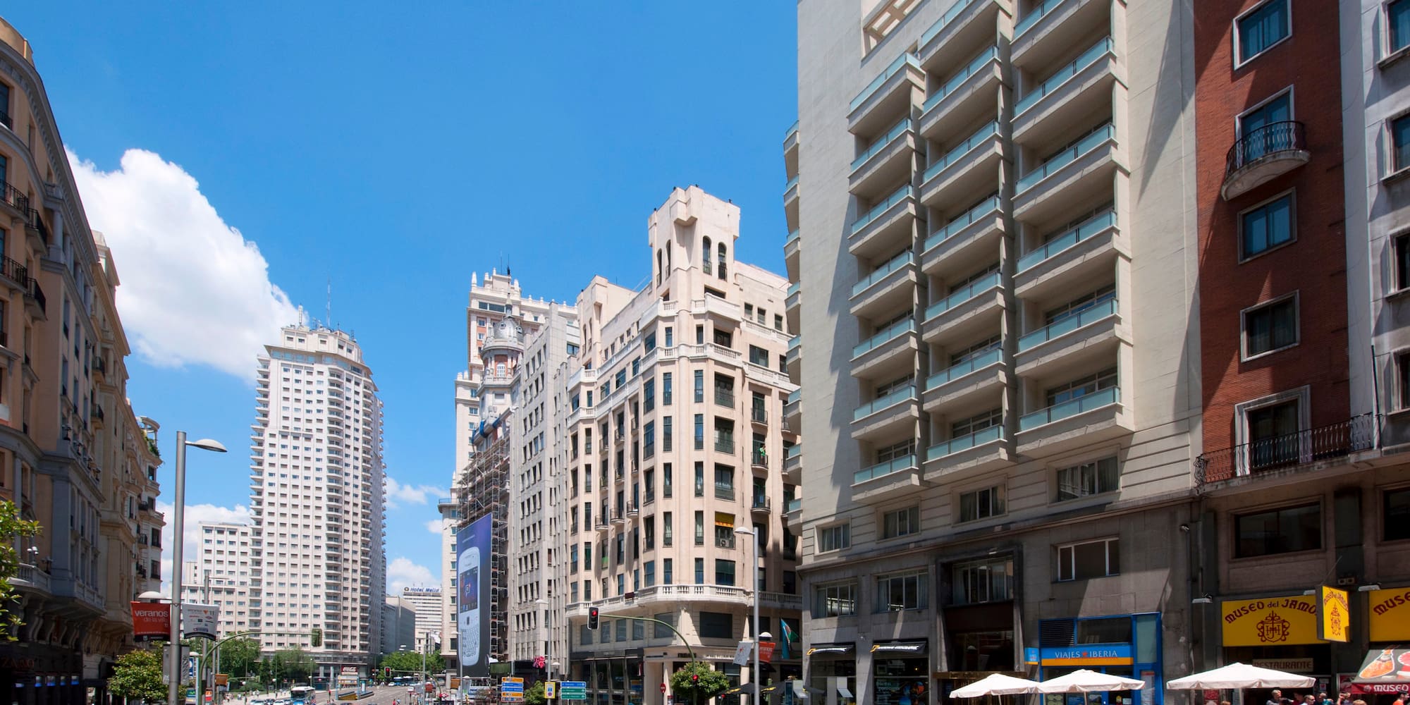 a street with cars and buildings