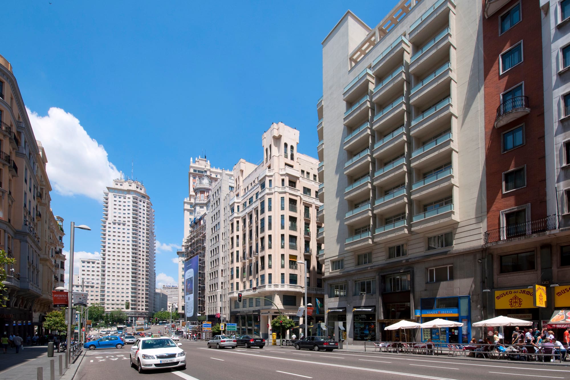 a street with cars and buildings
