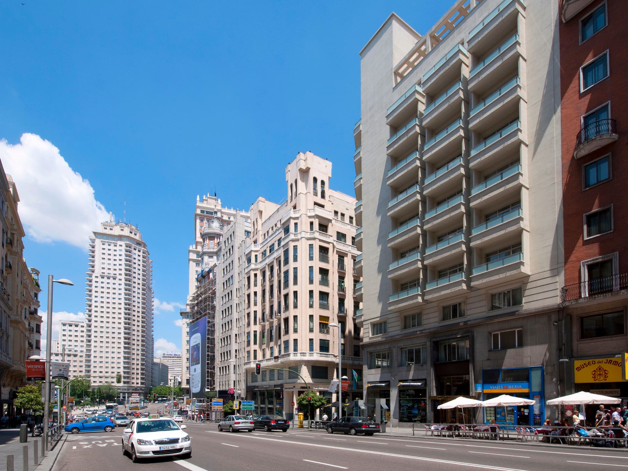 a street with cars and buildings