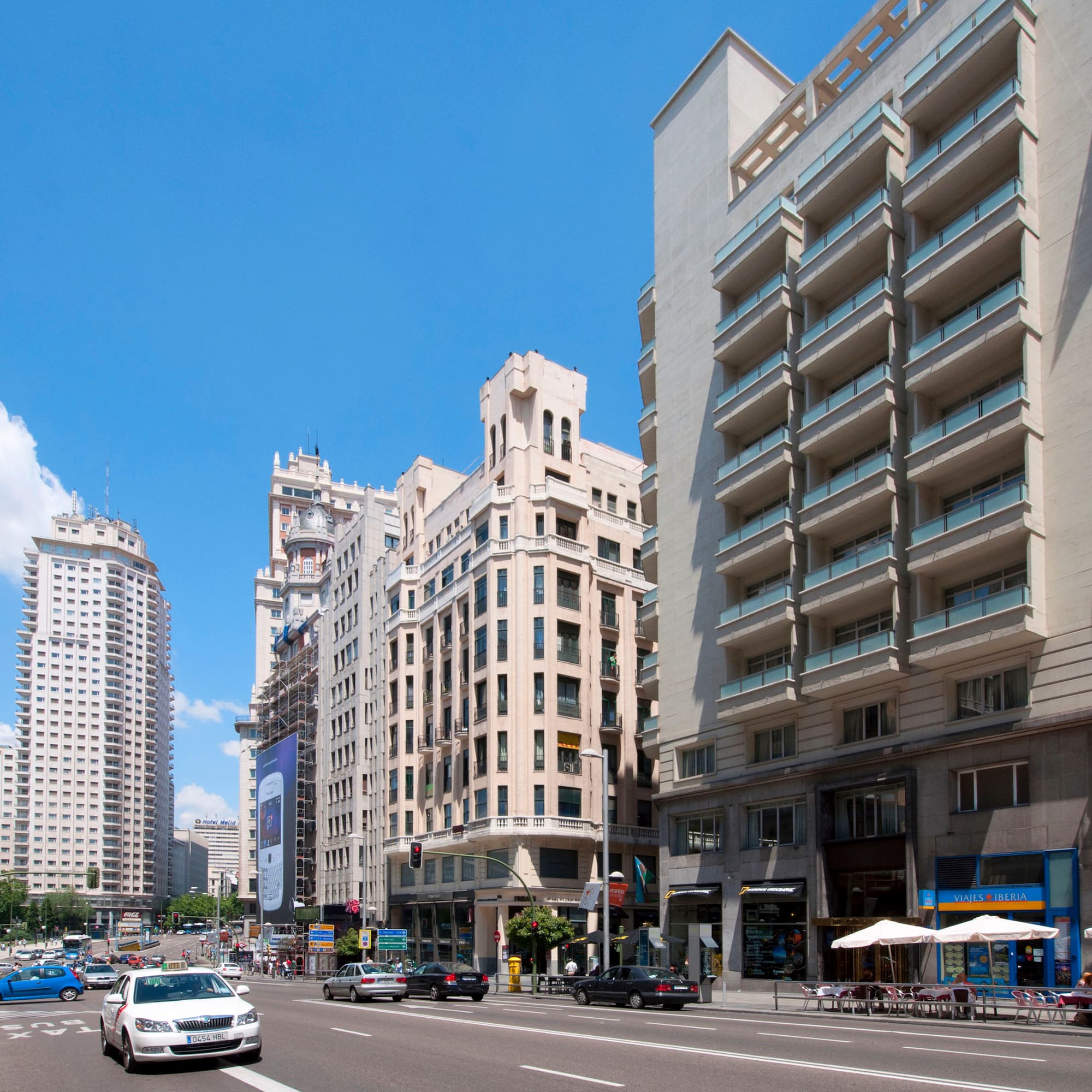 a street with cars and buildings