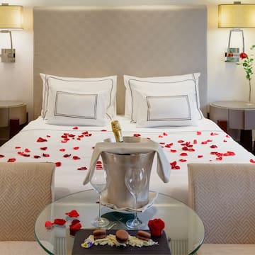 a bed with rose petals on it
