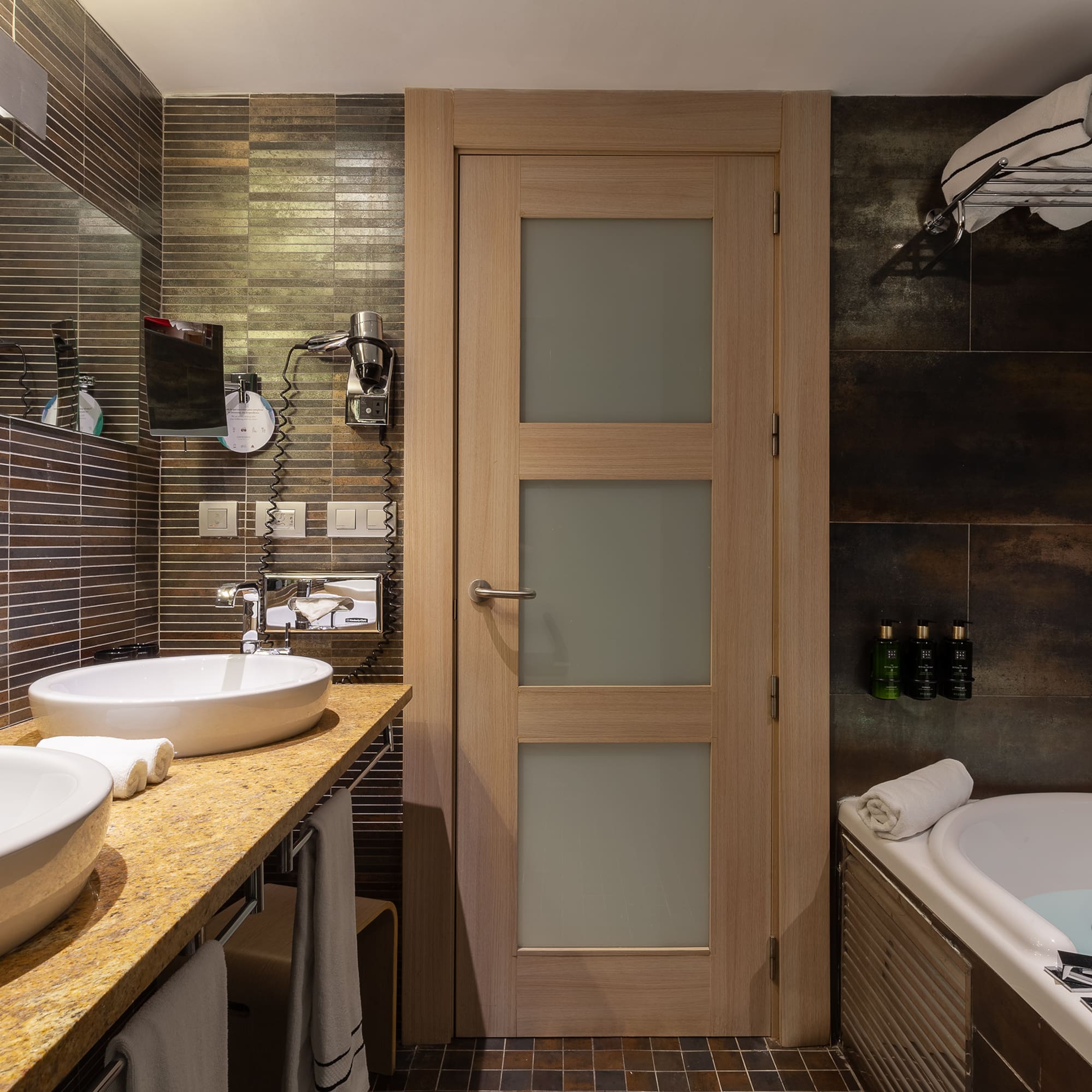a bathroom with a sink and tub