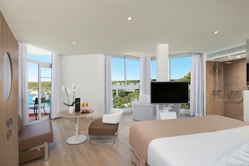 a room with a television and a bed