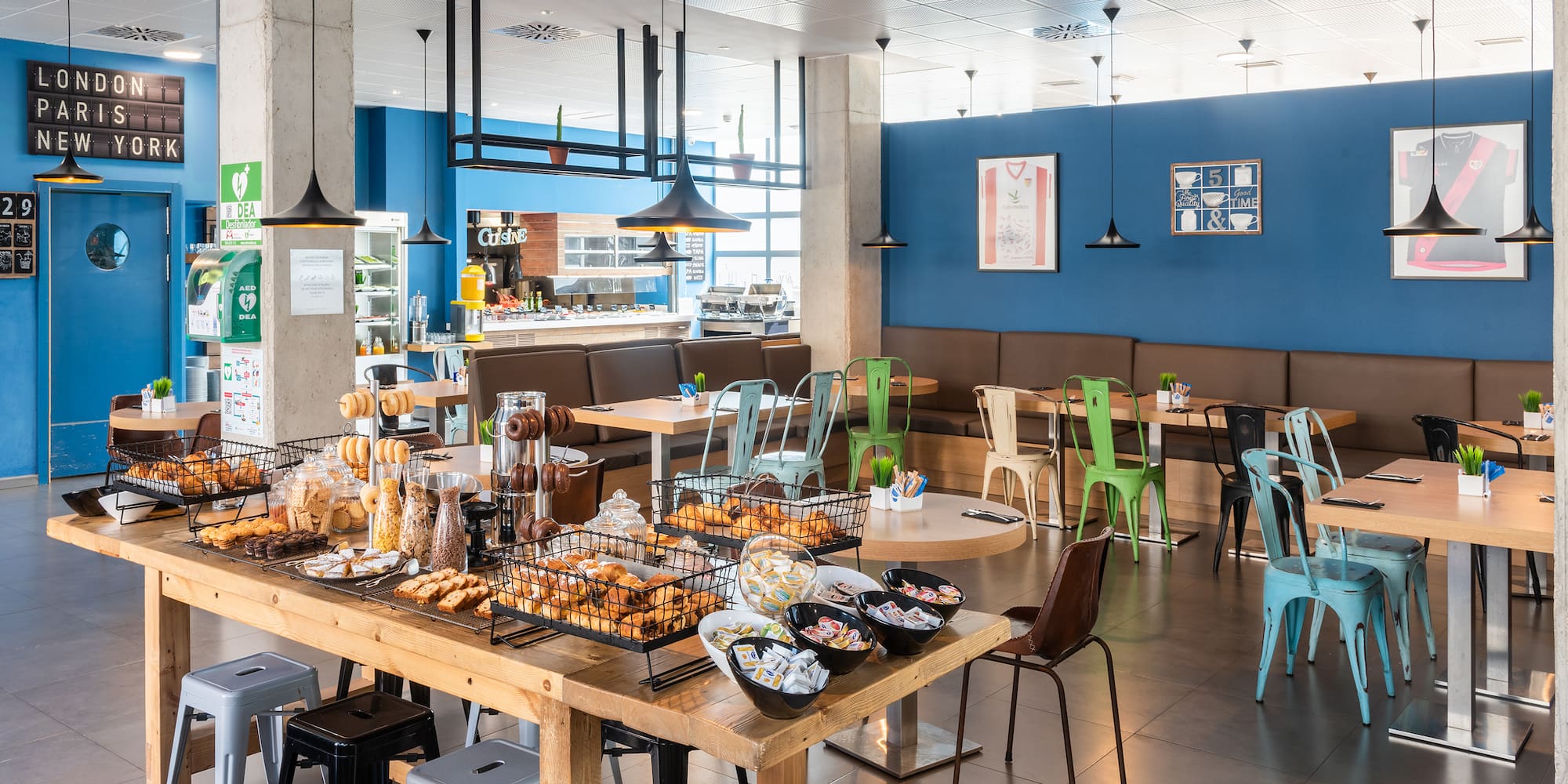 a large room with tables and chairs and food on it