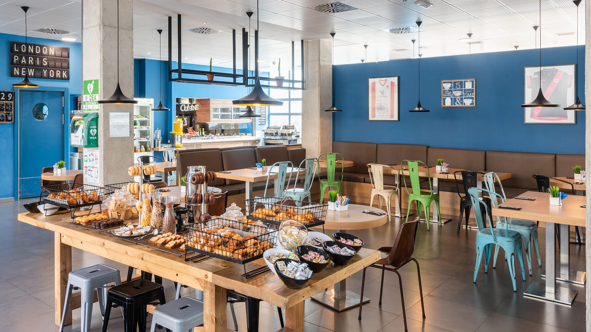 a large room with tables and chairs and food on it