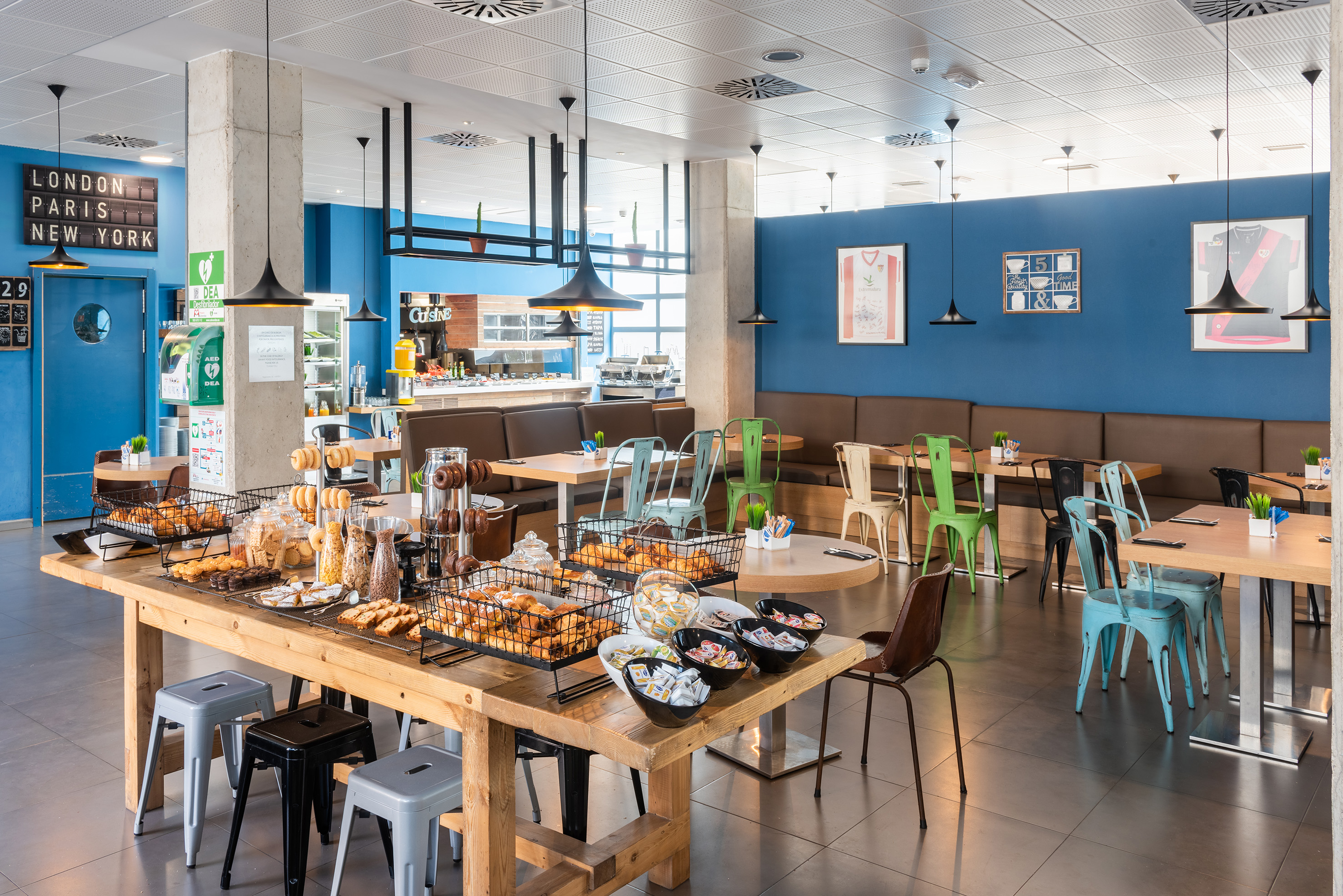 a large room with tables and chairs and food on it