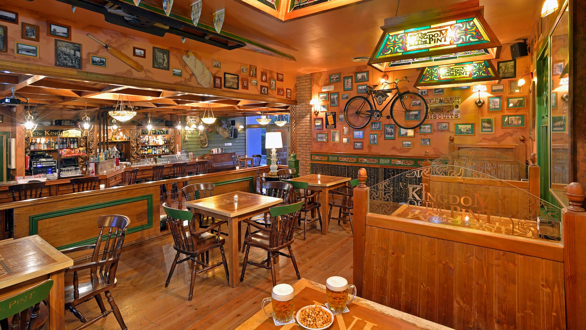 a room with tables and chairs and a bicycle on the wall