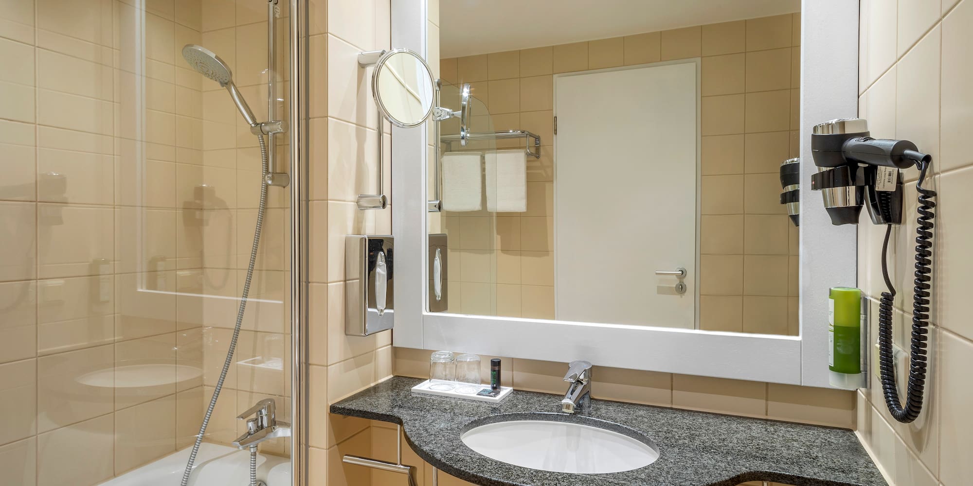 a bathroom with a mirror and sink