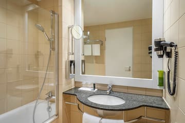 a bathroom with a mirror and sink