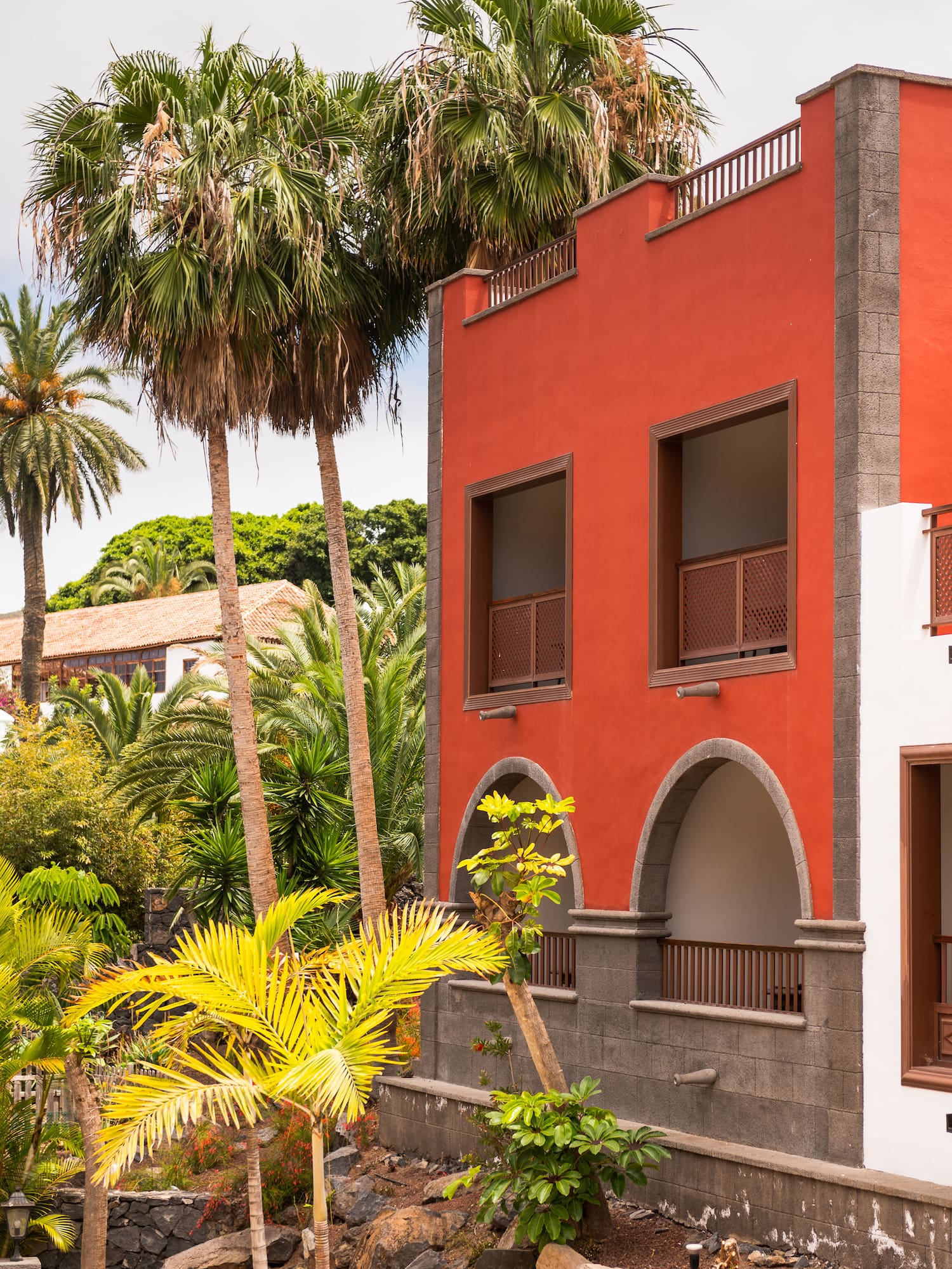 a building with palm trees