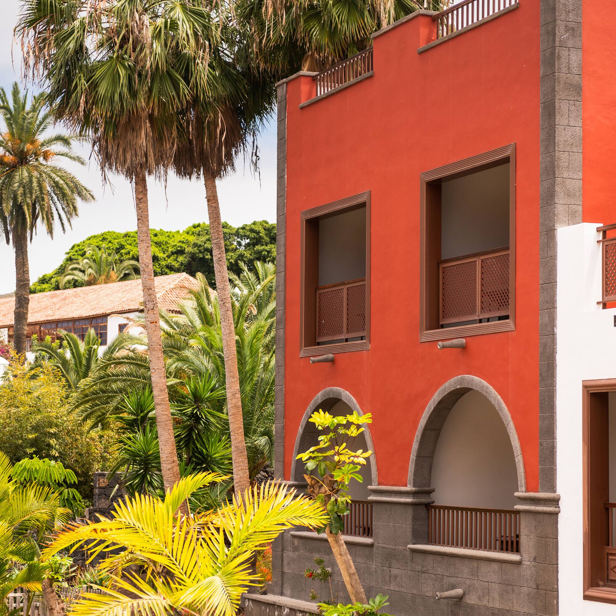 a building with palm trees